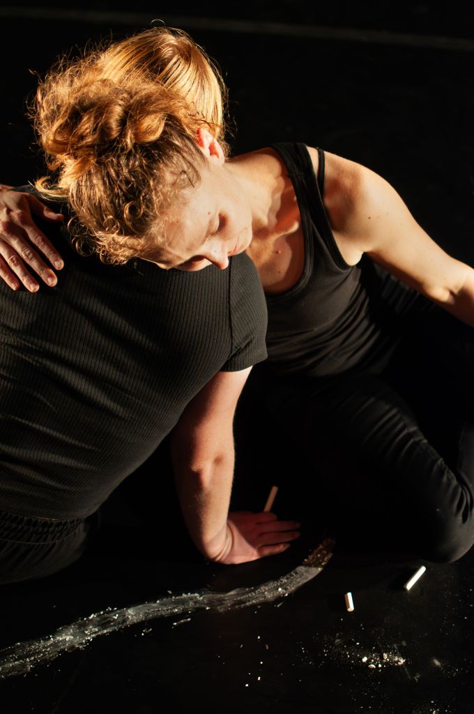 Two woman embrace
