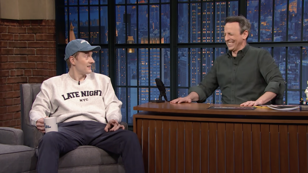 comic talking to host