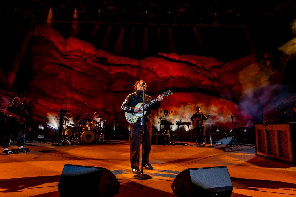 A photo of Lewis Capaldi performing on stage at Red Rocks.