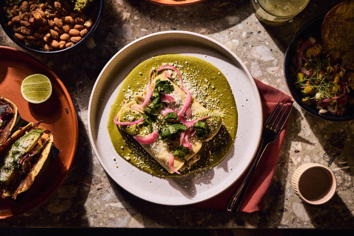 enchiladas smothered with green sauce on a plate