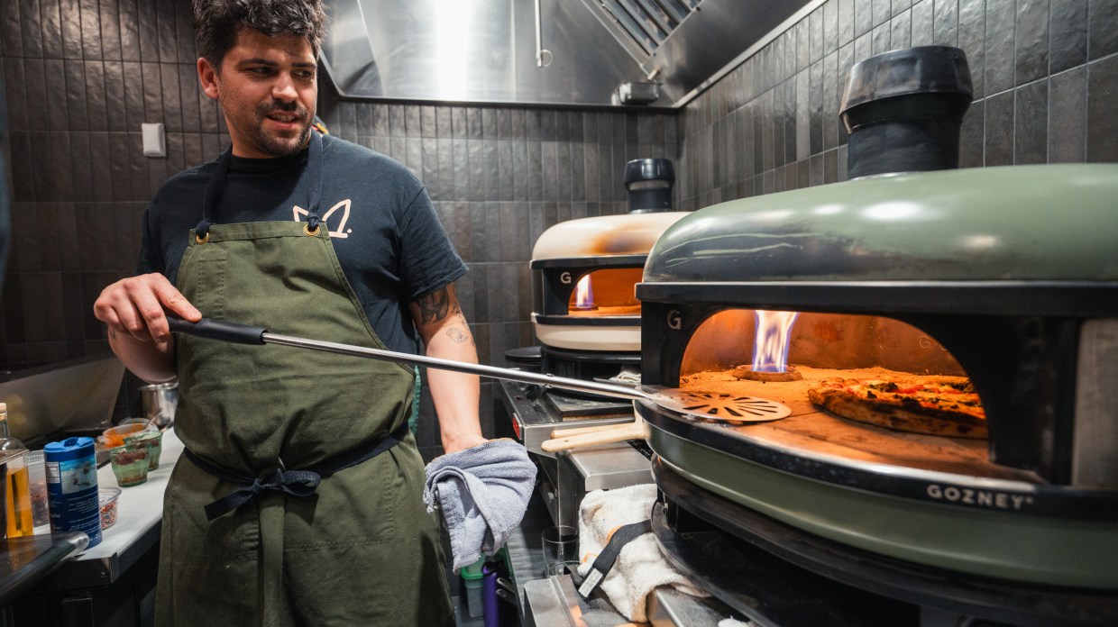 a man making pizza