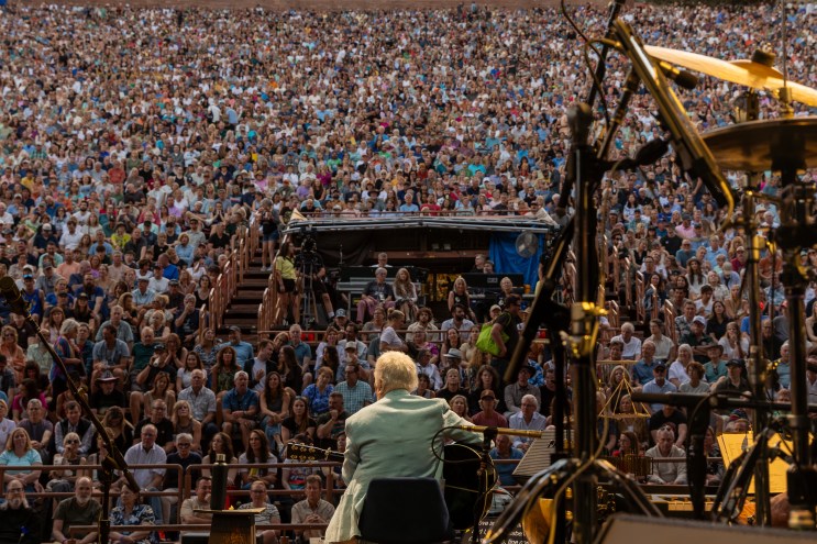 man playing to crowd at Red Rocks