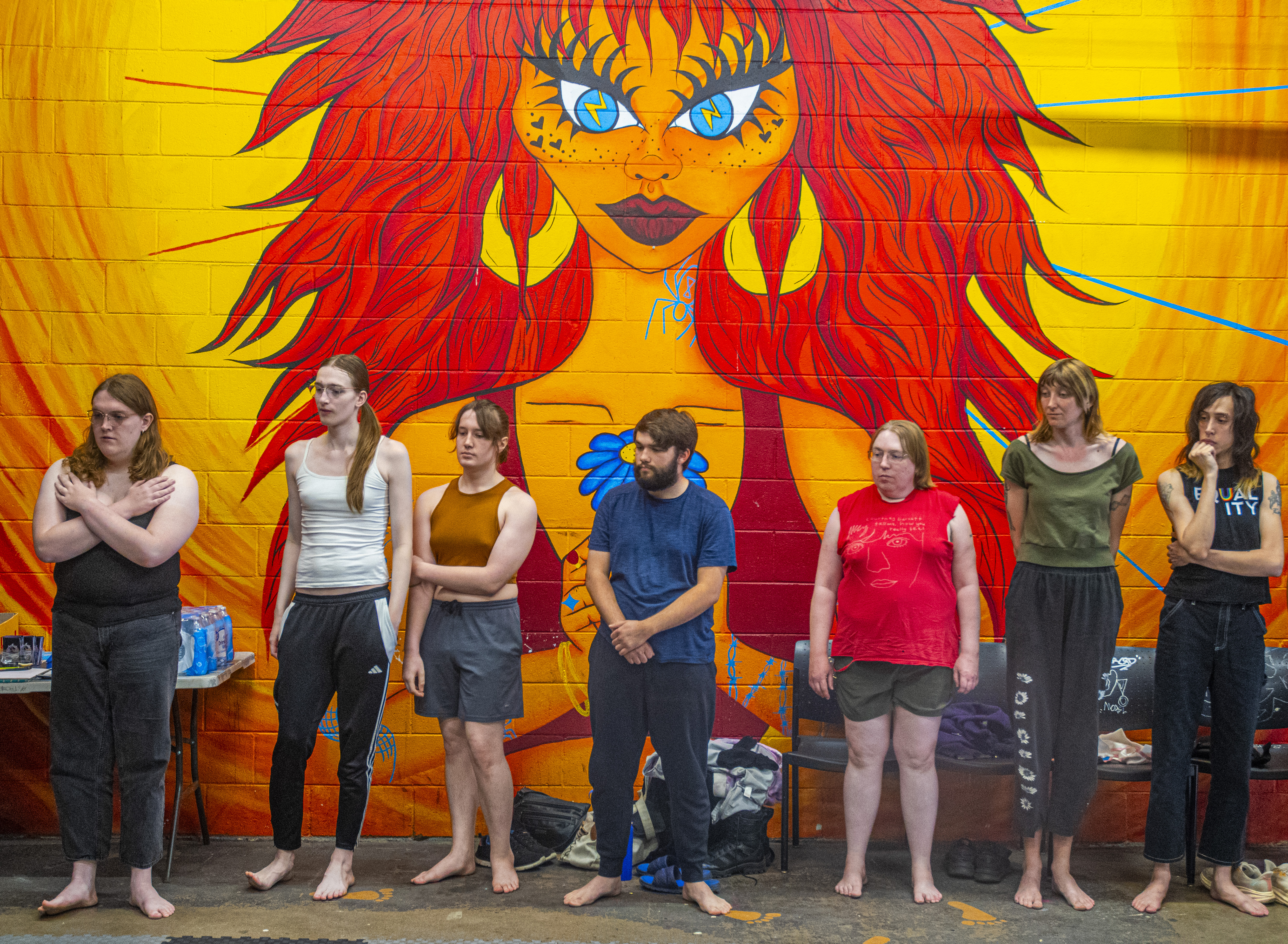 Students watch a demonstration during the self-defense class in June. 
