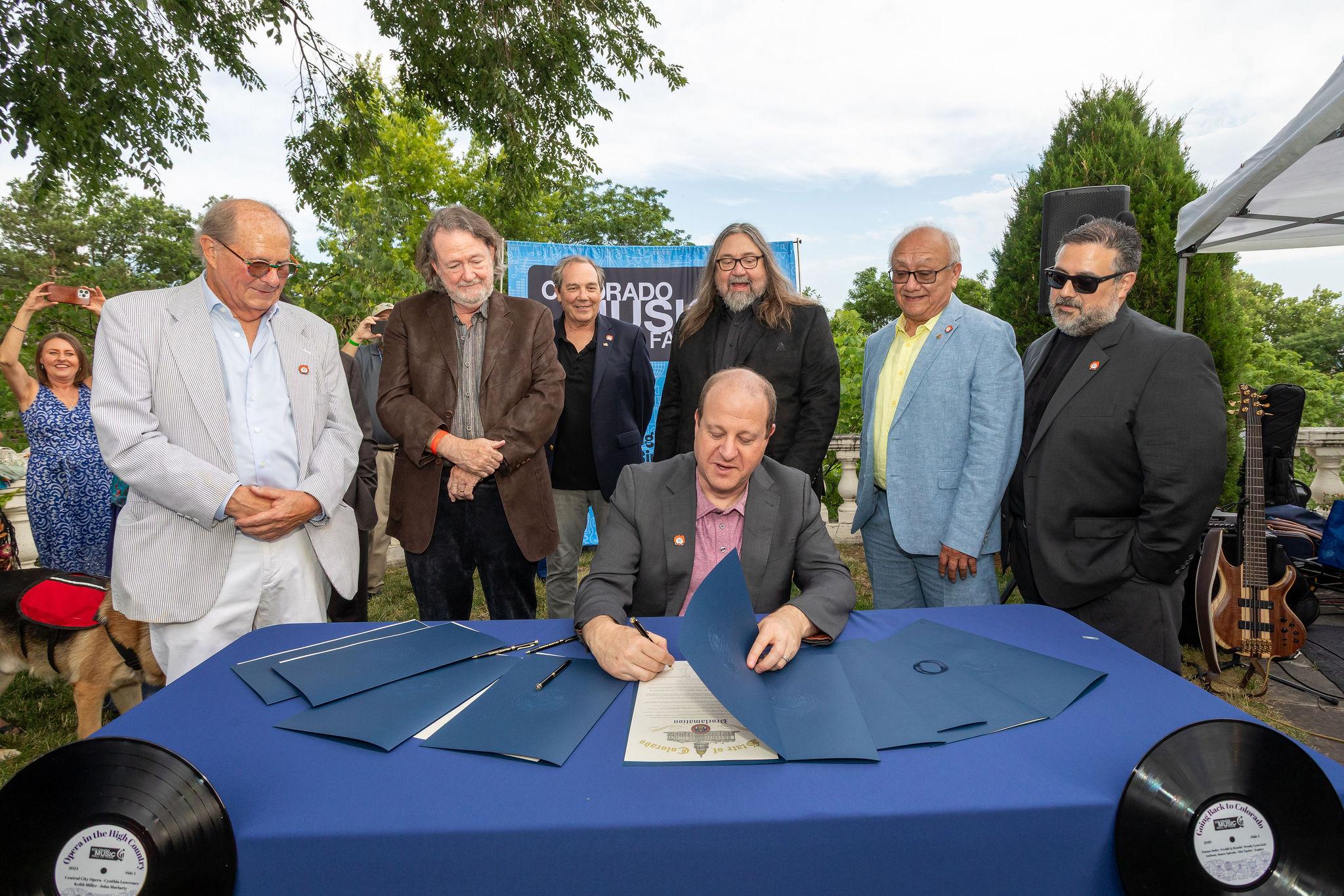 governor of colorado with members of widestpread panic