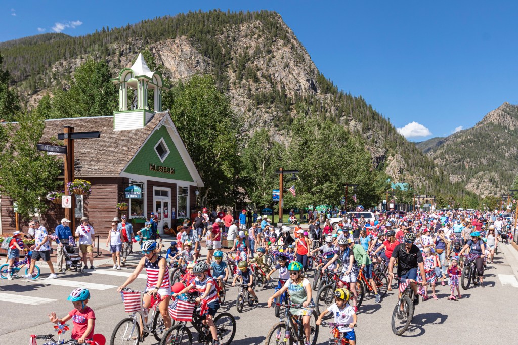 A crowd of families participating in Frisco's 4th of July bike parade