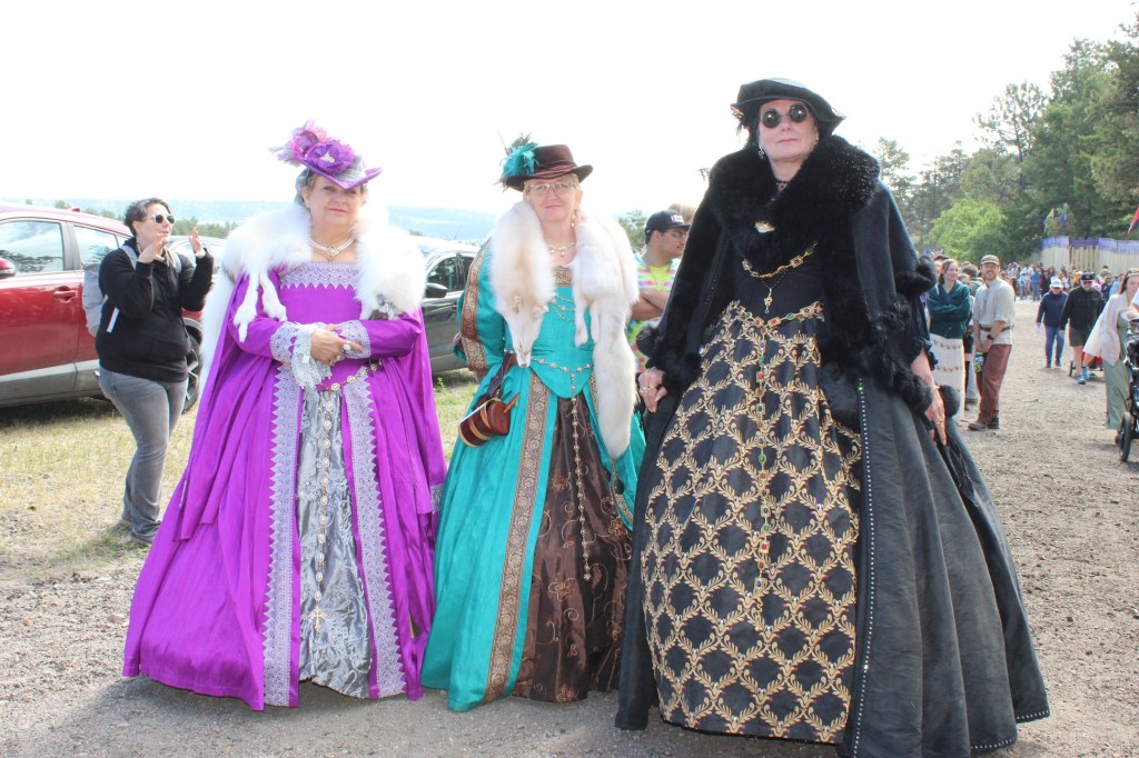 Three woman in massive dresses