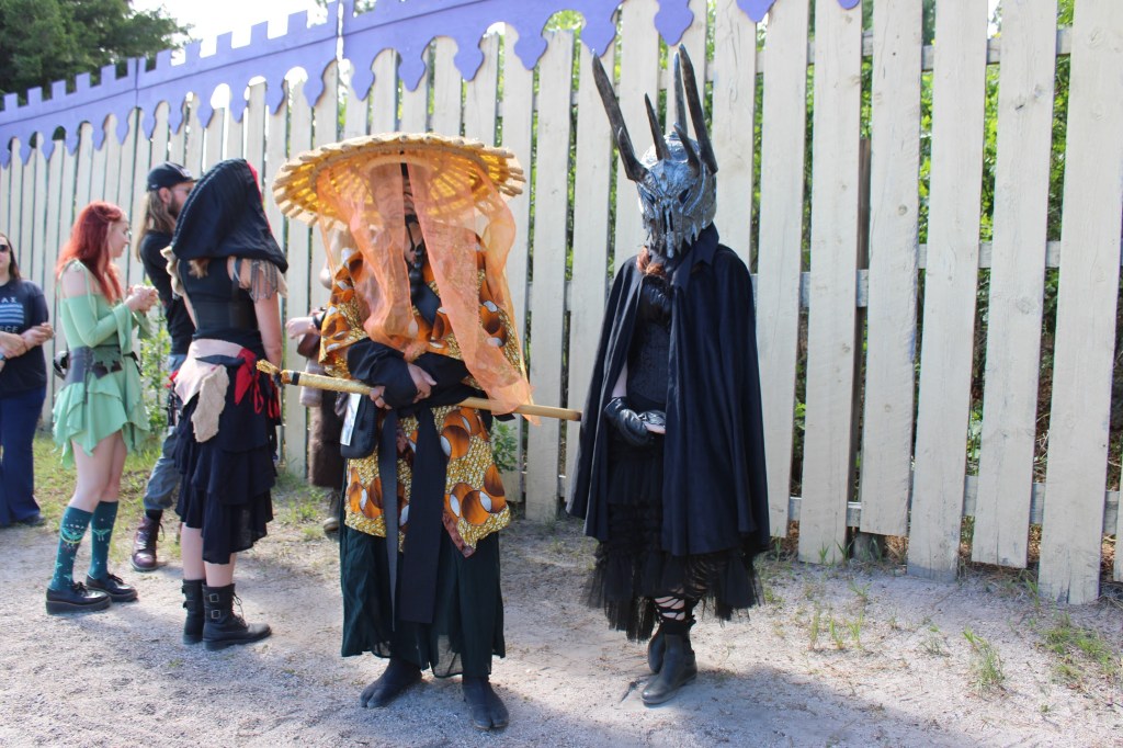 People in costume waiting in line