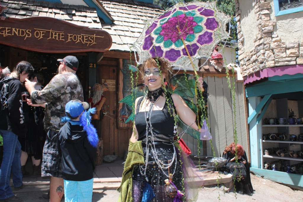 Woman holds an umbrella at the Ren Faire