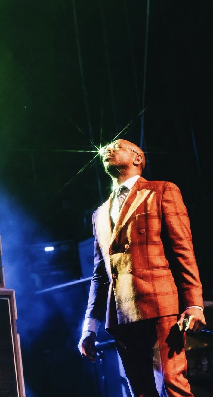 man in orange suit looking up