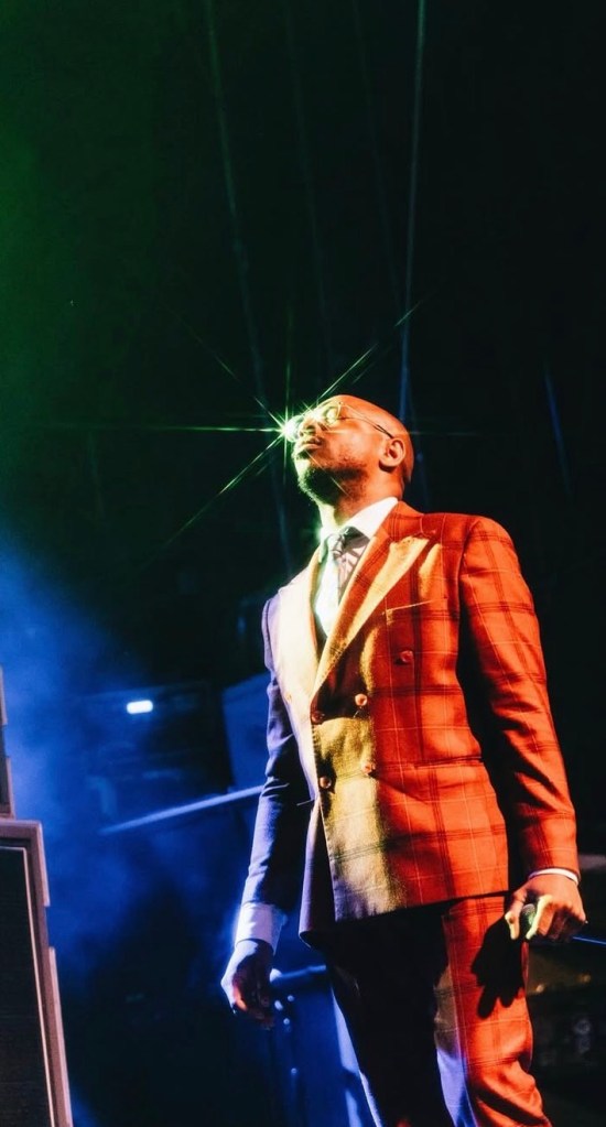 man in orange suit looking up