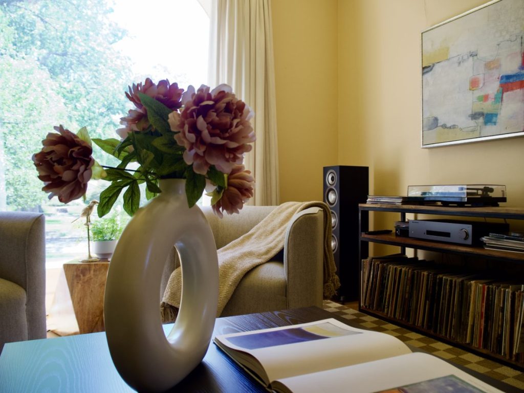 Flowers on a table in a living area.