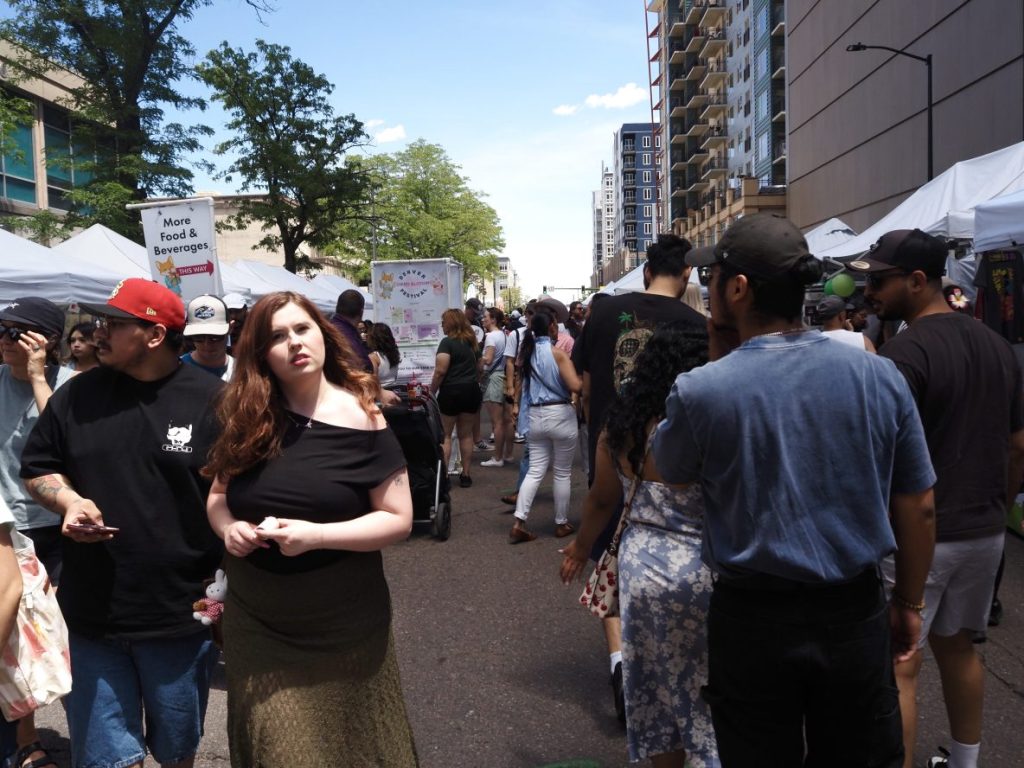 People walk along Lawrence Street.