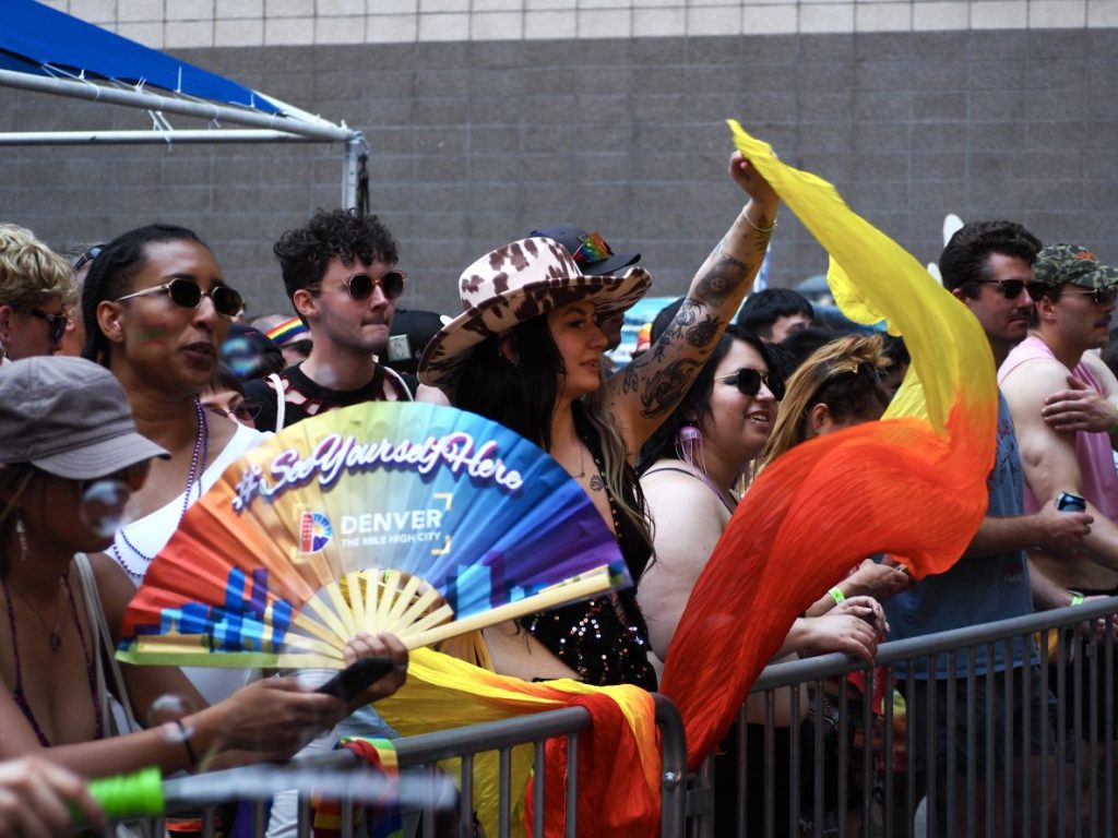 People cheering for a performance at Denver PrideFest