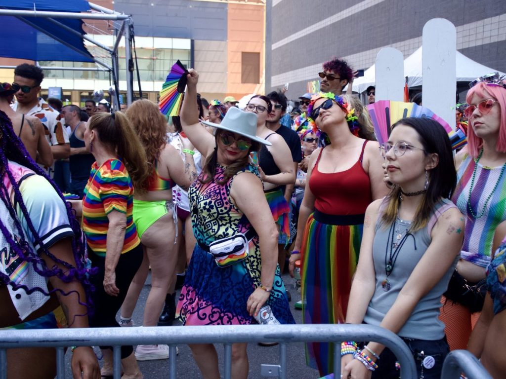 People cheering for a performance at Denver PrideFest