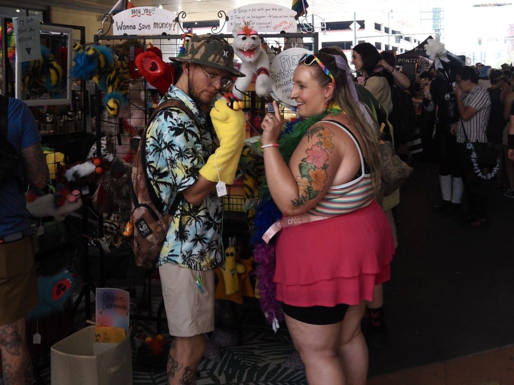 People looking at puppets
