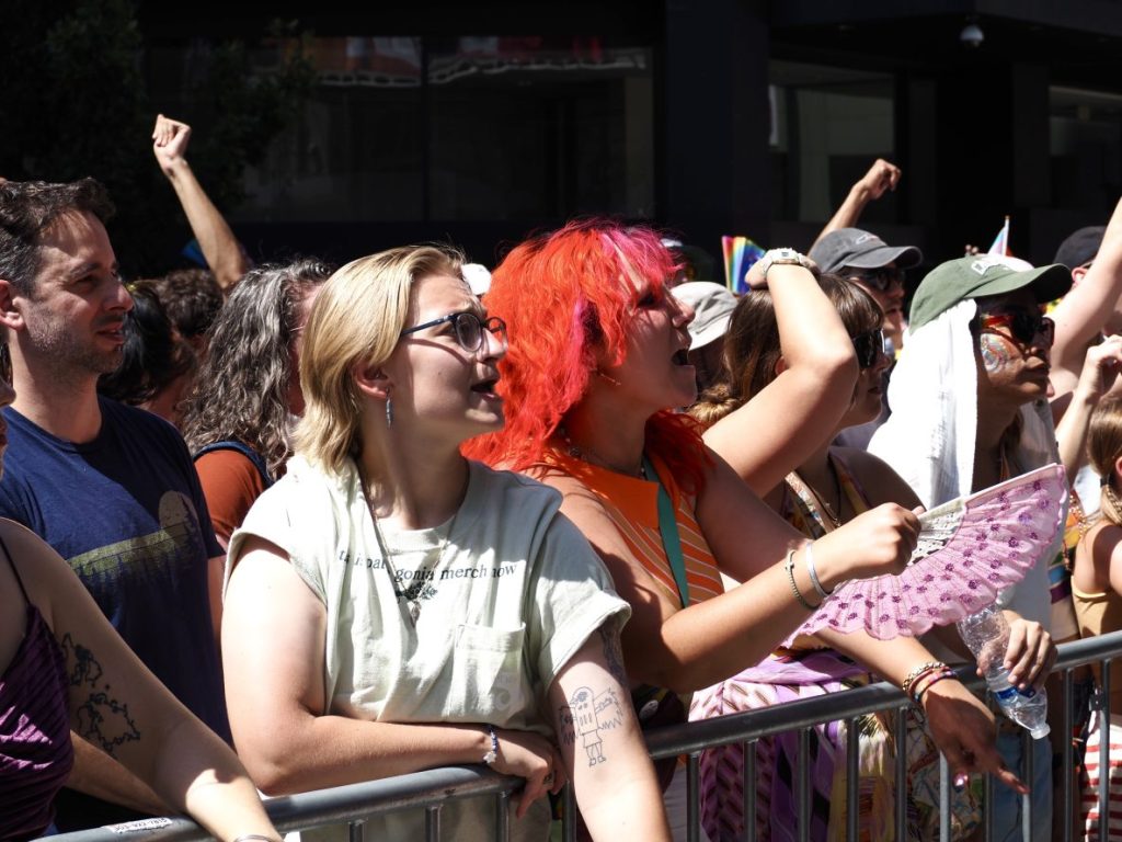 People cheering for a performance at Denver PrideFest