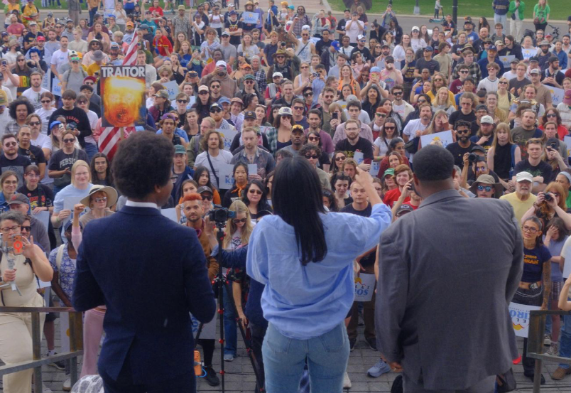Melat Kiros (center) during the rally-turned-protest on Sunday, June 14, beside Tennessee State Rep. Justin J. Pearson and Michigan State Rep. Donavan McKinney.