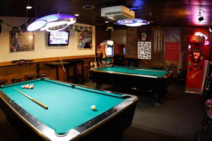 inside dive bar with pool tables