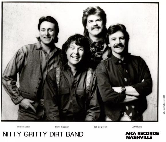 four men smiling