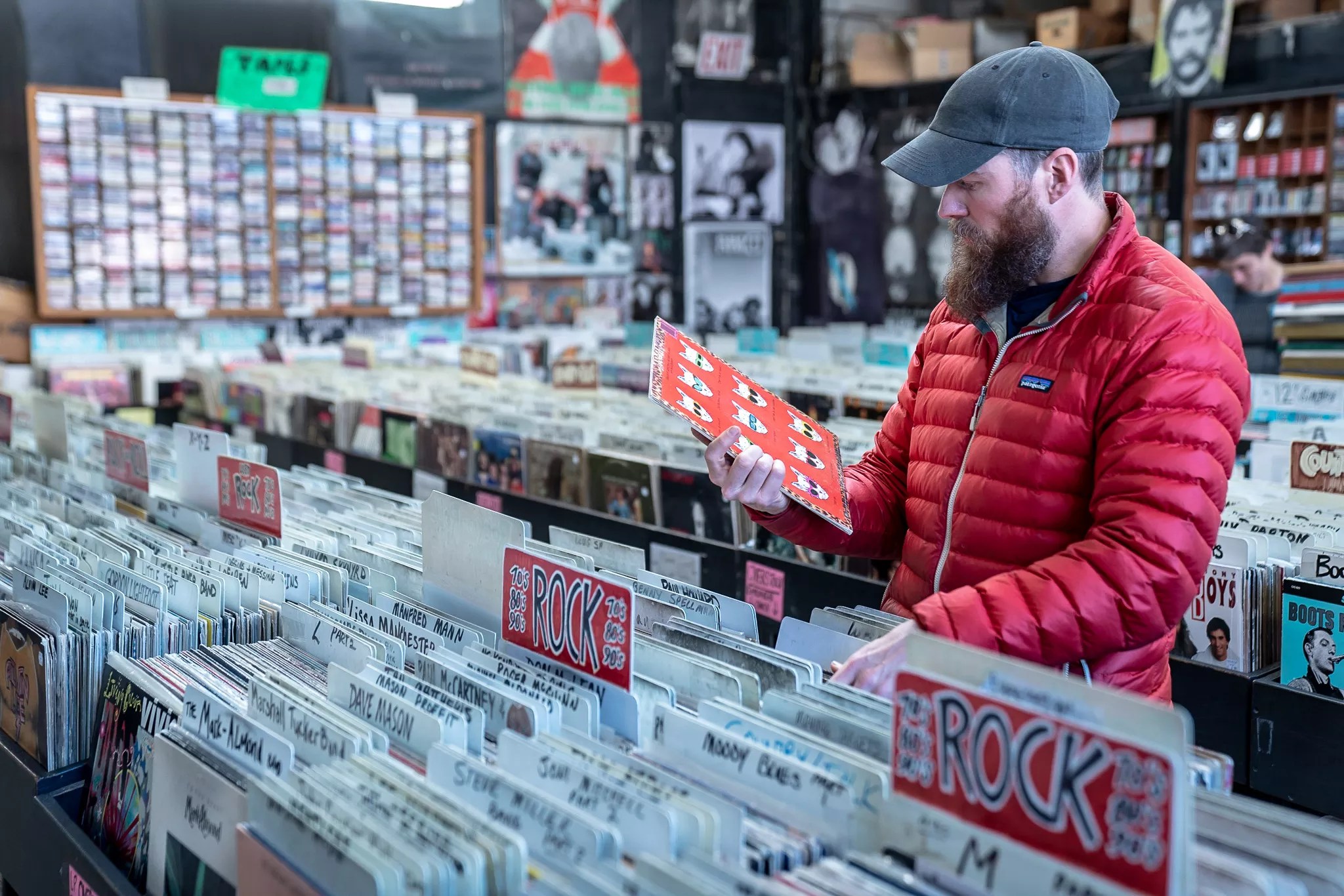 A customer sifts through Wax Trax's extensive collection of vinyl.
