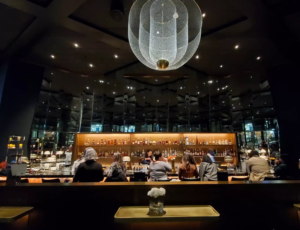 people sitting at a bar