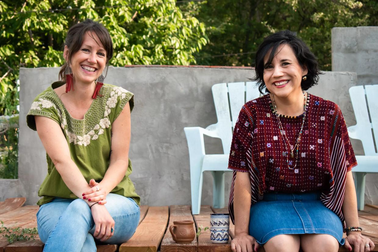 two women sitting outdoors