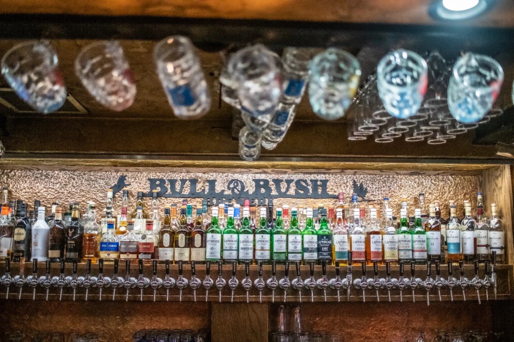 a bar lined with bottles
