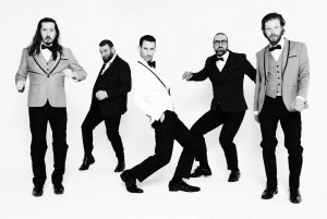 Members of Denver band Milquetoast & Co. pose in black and white.