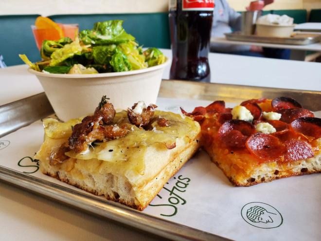 two slices of pizza and a salad