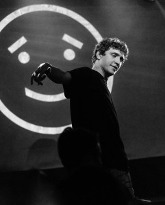 black and white photo of man in black hoodie