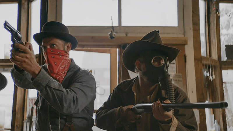 men in cowboy hats and bandanas