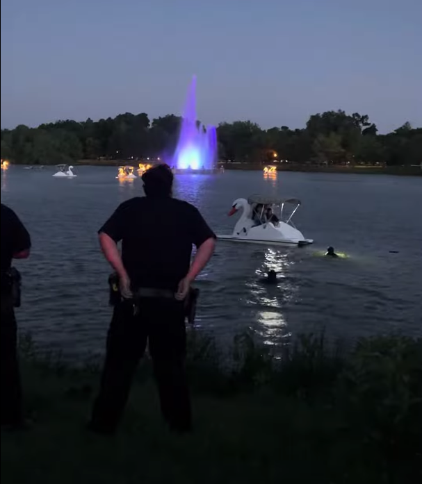 Police in the water during the drowning incident at City Park on Sunday.