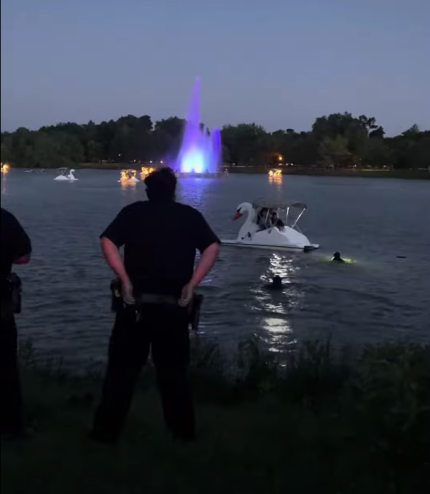 Police in the water during the drowning incident at City Park on Sunday.