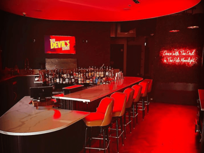 a bar with red lights