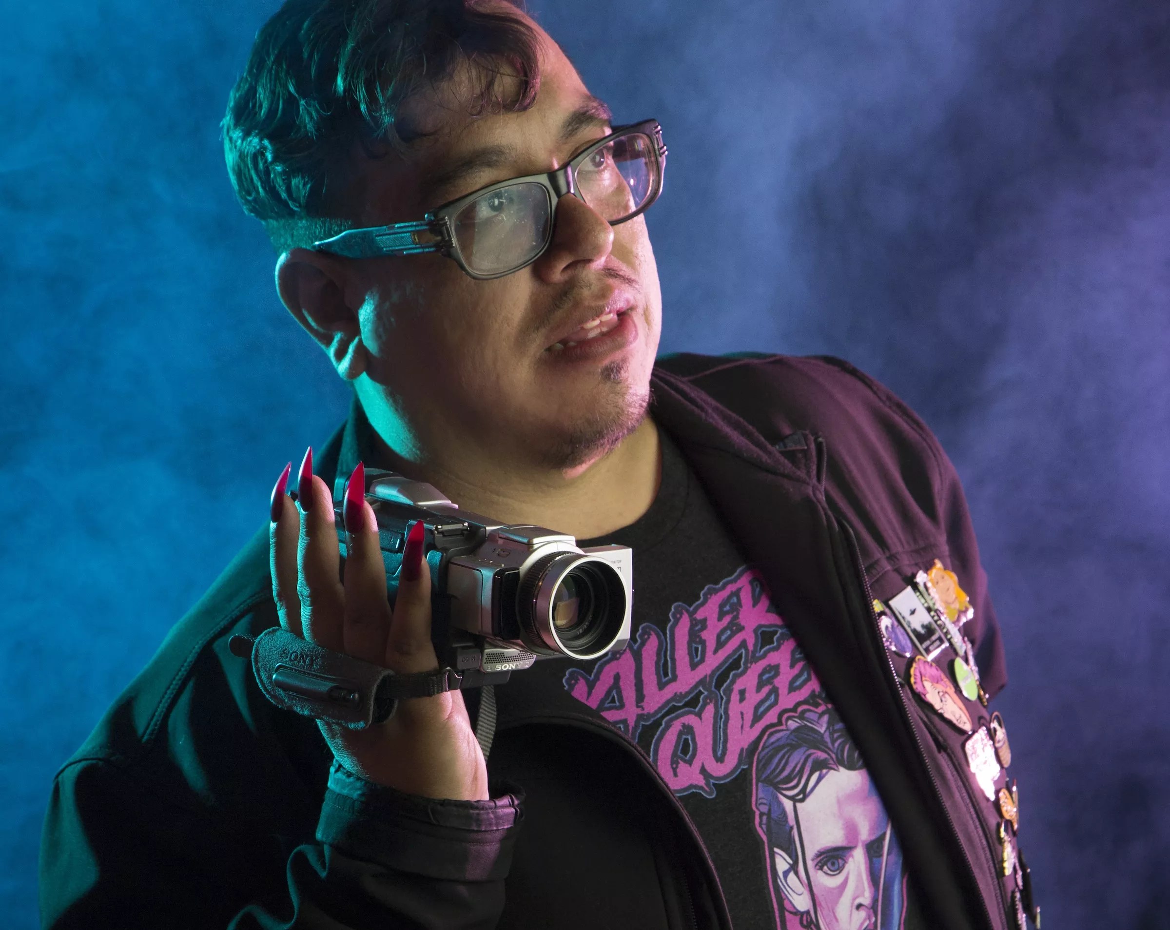 man in glasses with movie camera