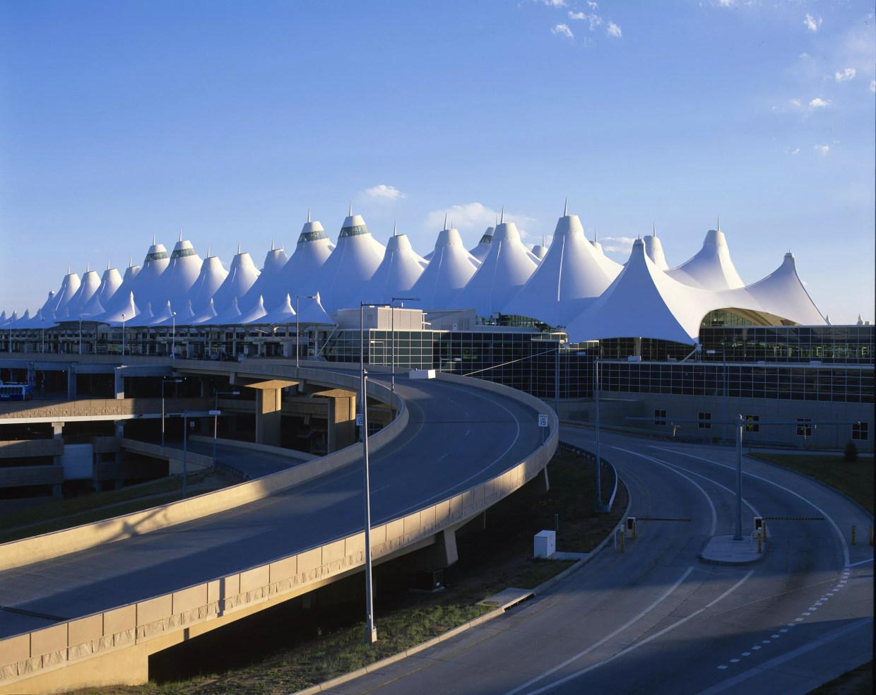 denver airport with tents and blue sky