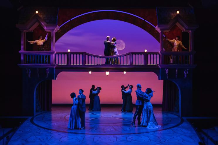 ballroom dancers on theater set at sunset