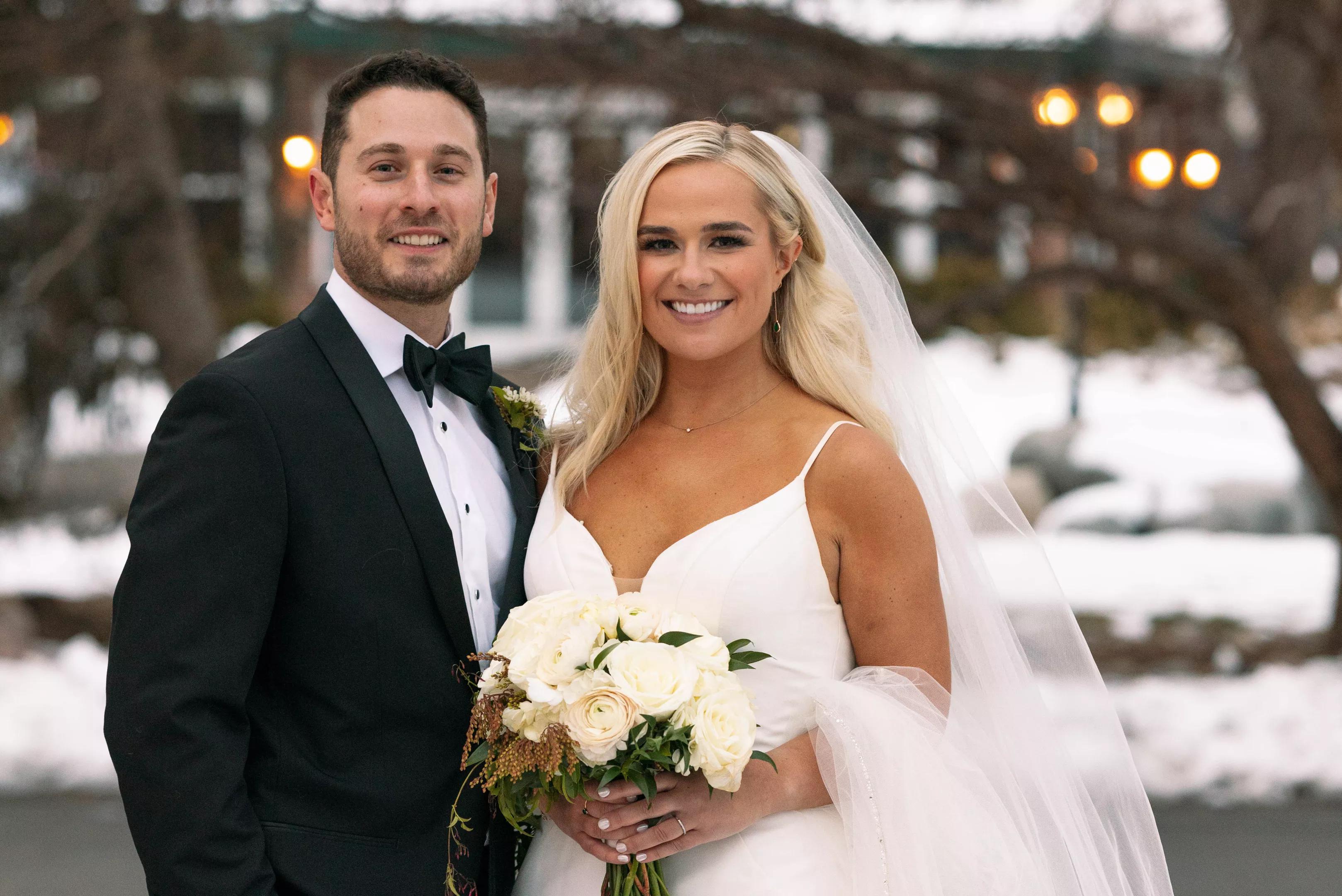 Emily and Brennan pose for a wedding portrait.
