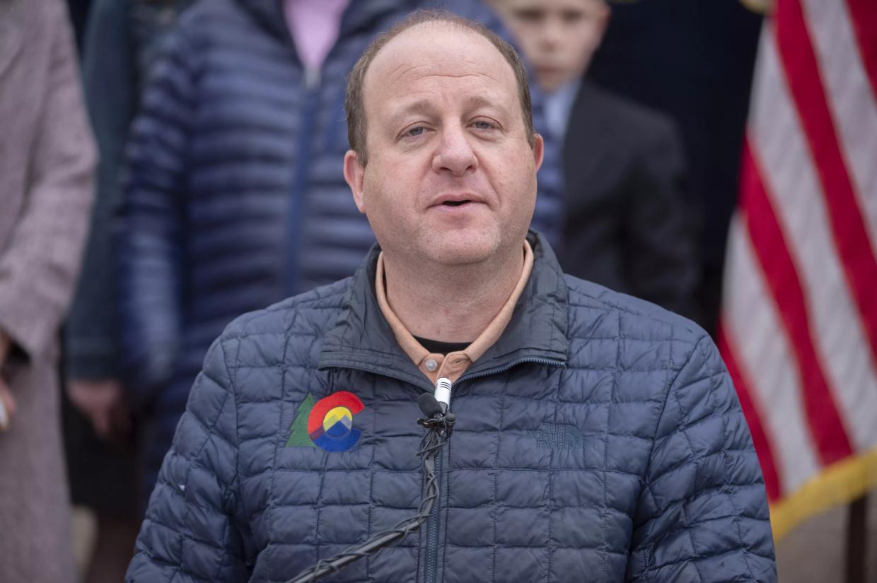 A man in a down jacket with the Colorado logo.