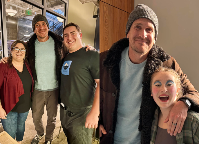 Actor Jason Segel posing with fans in Denver.