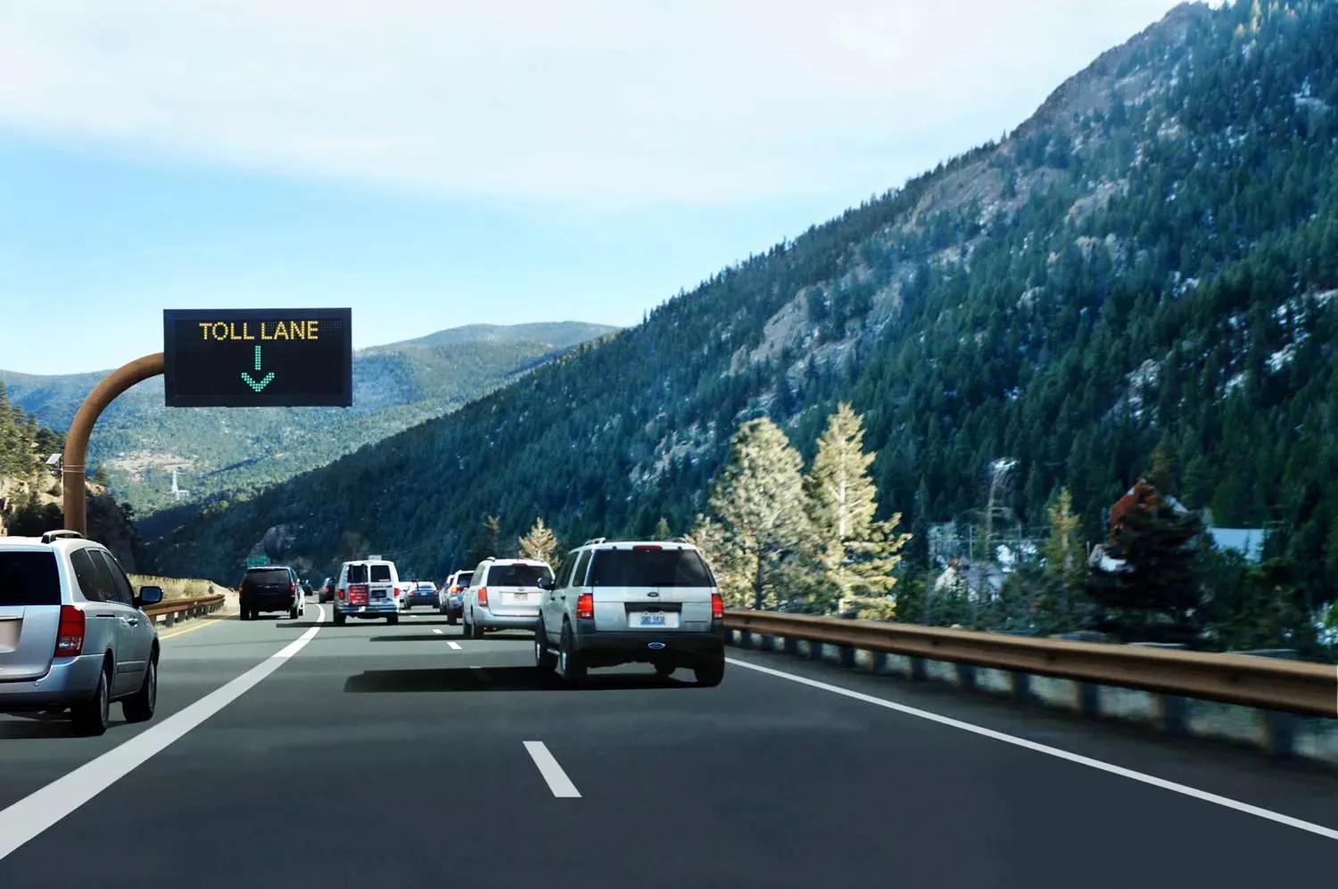 Vehicles driving along the Interstate 70 Mountain Express Lane.