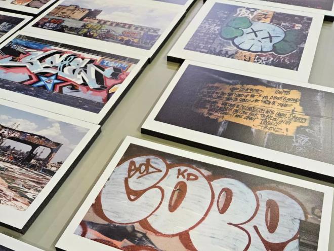 photos of graffiti laid out on a table