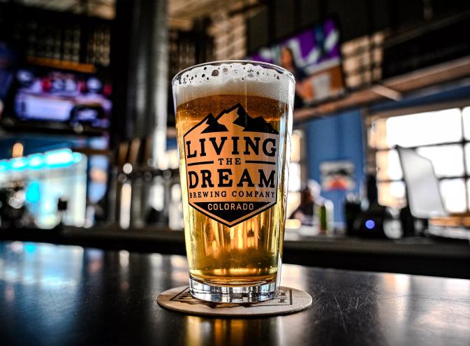 Beer glass with golden beer inside.