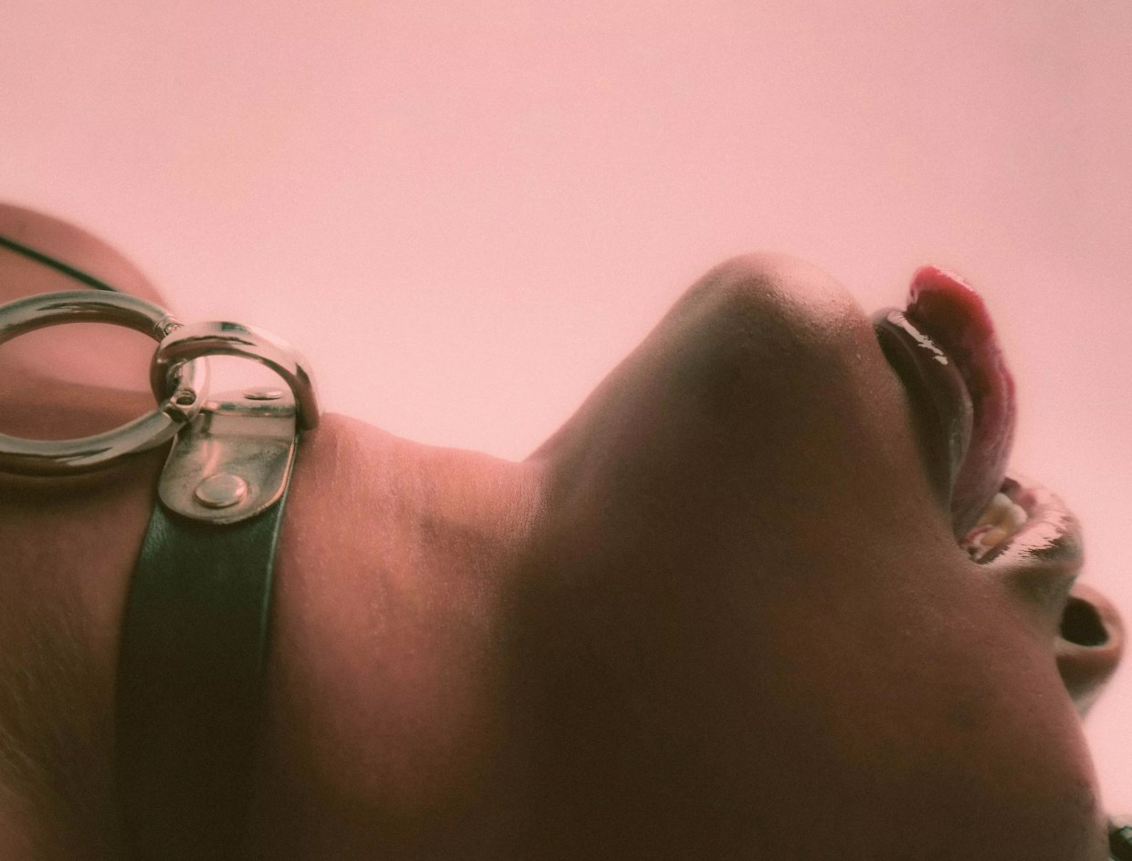 Woman lying down with her tongue out