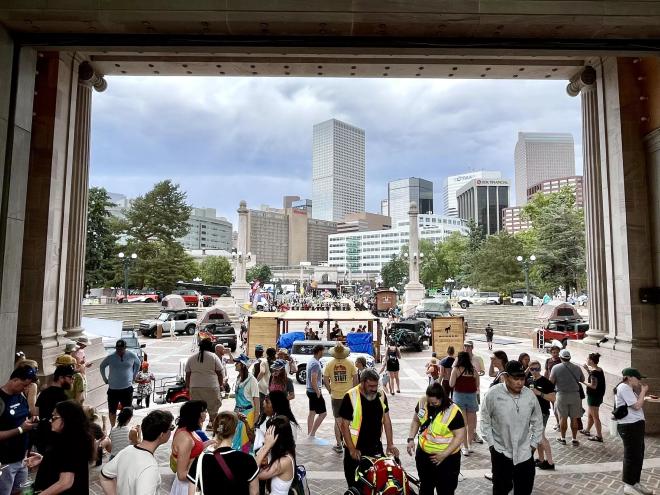 looking through outside amphitheatre at festival-goers
