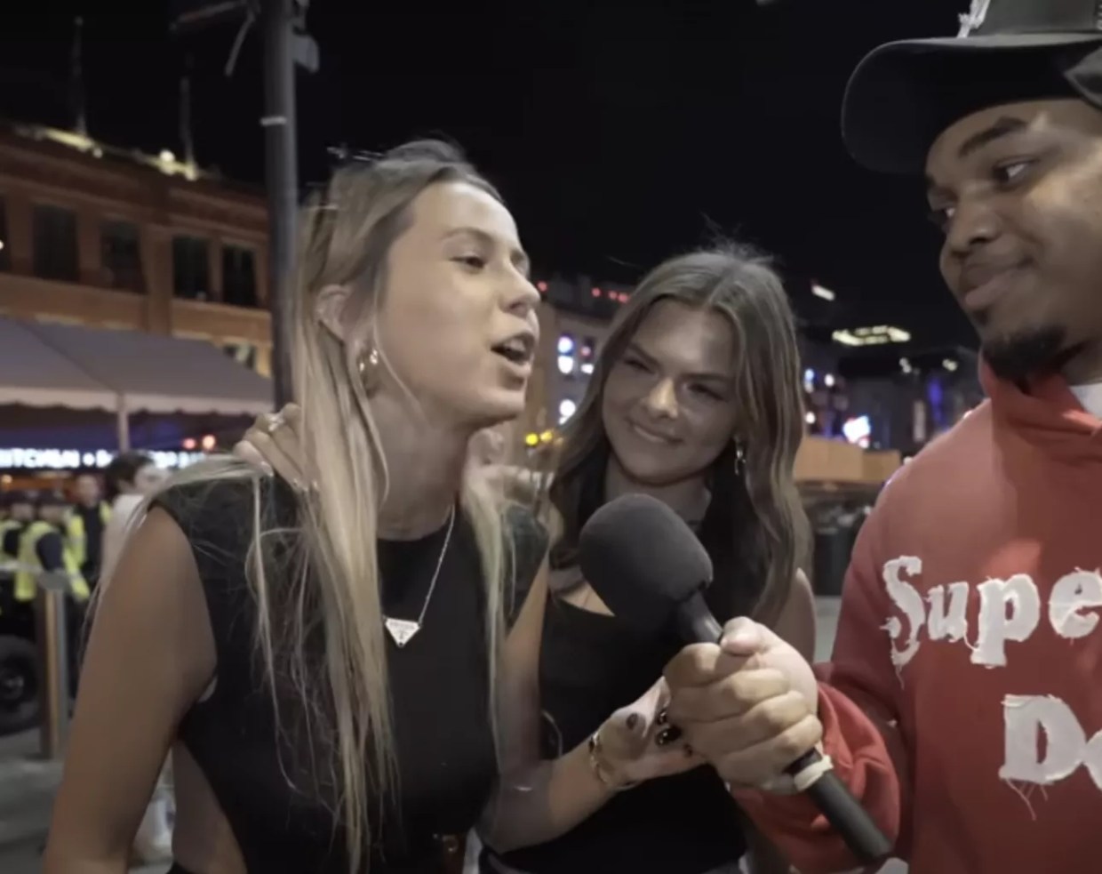 A screenshot from the viral "hawk tuah" video.