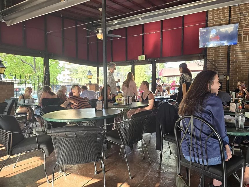 people on enclosed outdoor patio