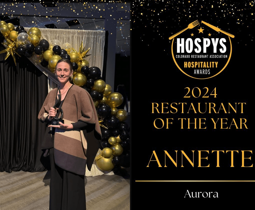 woman holding an award