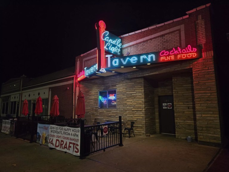 bar exterior with a neon sign
