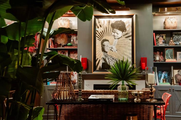 restaurant with tropical plants and art